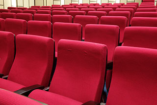 What is the material of the auditorium chair suitable for school use?