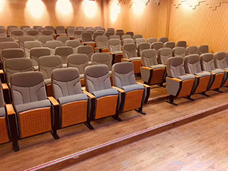 What design techniques are used in auditorium chairs?