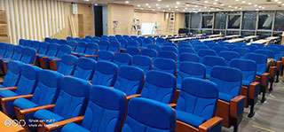 What kind of "mystery" is hidden in the placement of auditorium chairs?