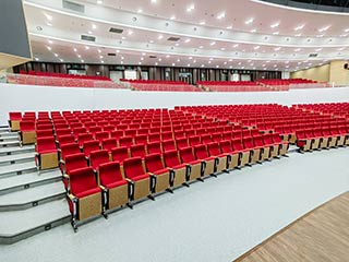 What are the tips for choosing auditorium chairs for a school auditorium with high-grade decoration?