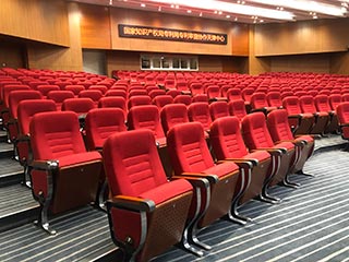 What processes are used in the production of auditorium chairs?