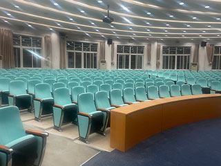 How much do you know about the writing pad hidden in the auditorium chair?